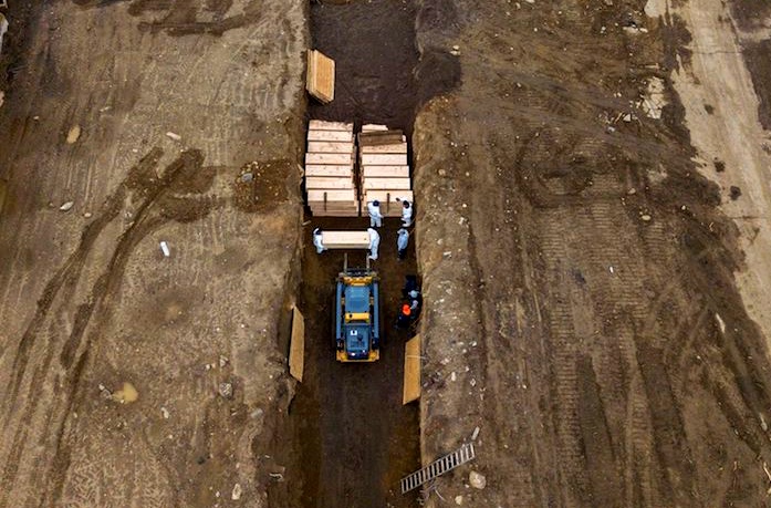 Drone pictures show bodies being buried on New York’s Hart Island where the department of corrections is dealing with more burials overall, amid the coronavirus disease (COVID-19) outbreak in New York City, U.S., April 9, 2020. (REUTERS/Lucas Jackson)