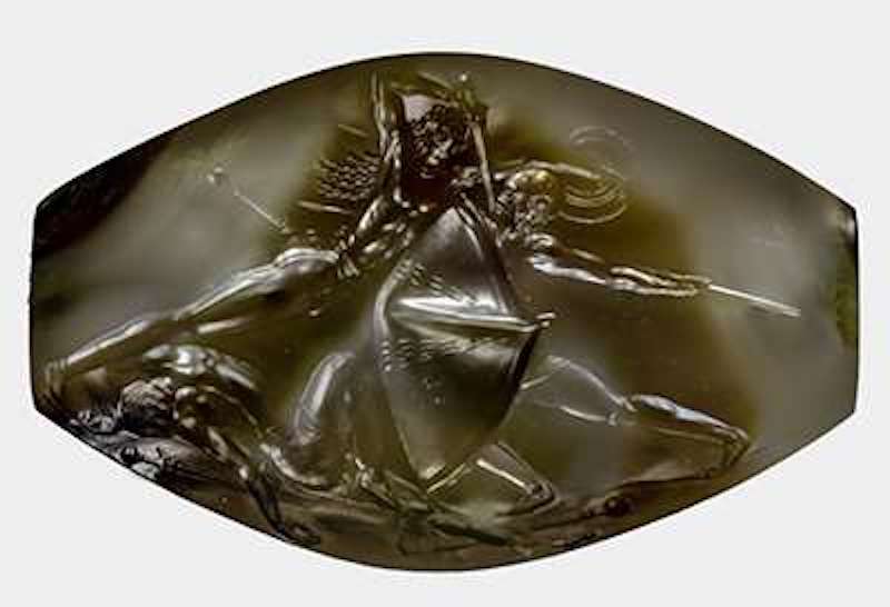 The tiny sealstone depicting warriors in battle measures just 1.4 inches across but contains incredible detail. Credit: University of Cincinnati