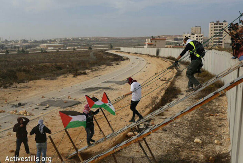 Palestinians cross Israeli apartheid wall. (Photo: via Activestills.org)